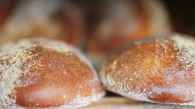 Fresh bakery production. Freshly baked bread production. Rye bread loaf