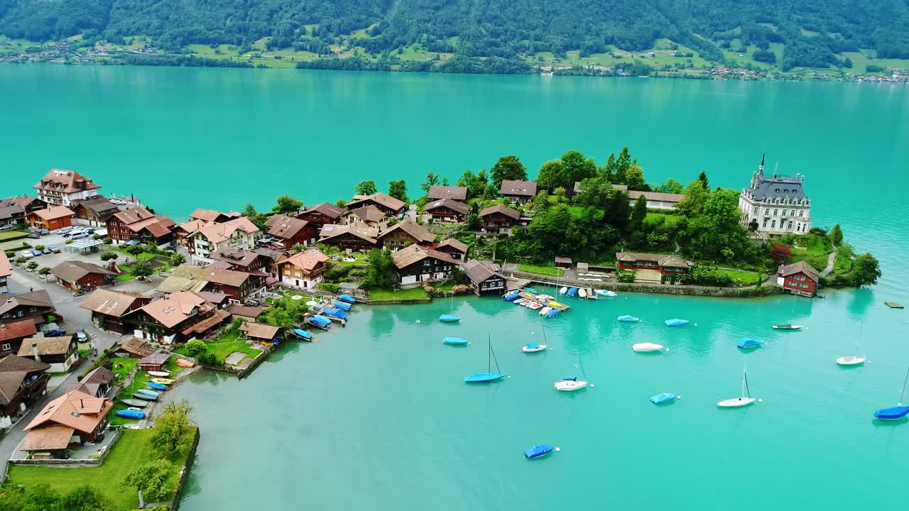 Peaceful Brienz Lake shoreline and charming Iseltwald chalets in Swiss Alps, 4K