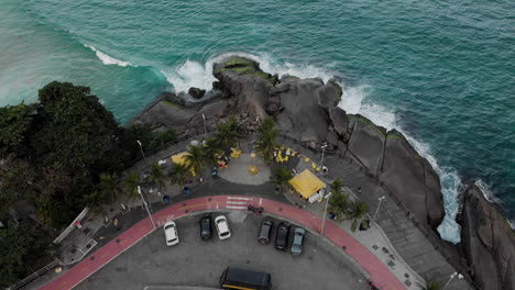 aerial top down view on a lookout point in the beach neighbourhood of leblon in rio de janeiro with a small parking space and kiosk