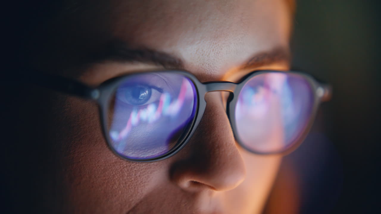 Diagrams woman glasses reflection closeup. Market trader face looking charts