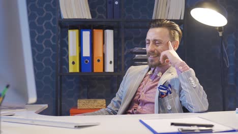 businessman completing his work, completing project in his office and relaxing.