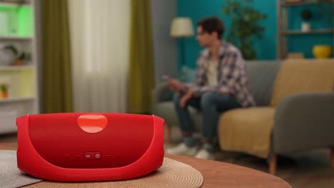 red portable speaker in living room