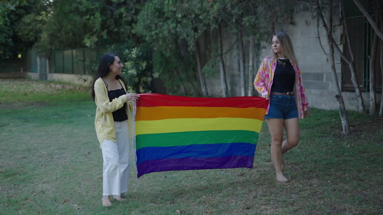 Two Women Holding a Pride Flag