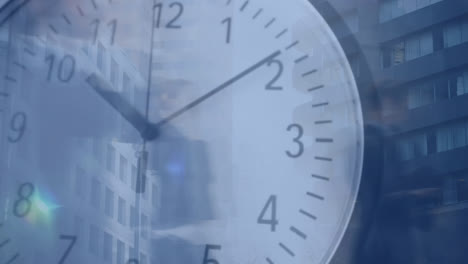 people walking fast in the city with clock in the foreground