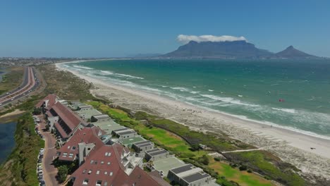 drone shot of the beautiful kitesurf spot dolphins beach with view of table mountain