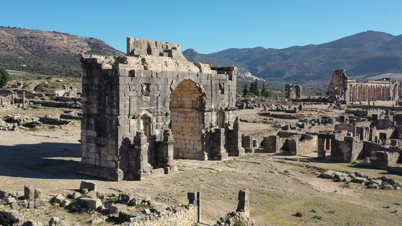 Volubilis is an ancient Roman site in Morocco, known for its well-preserved ruins, decorative mosaics, temples, and the famous Arch of Caracalla.