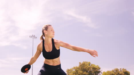 sportswoman practicing discus