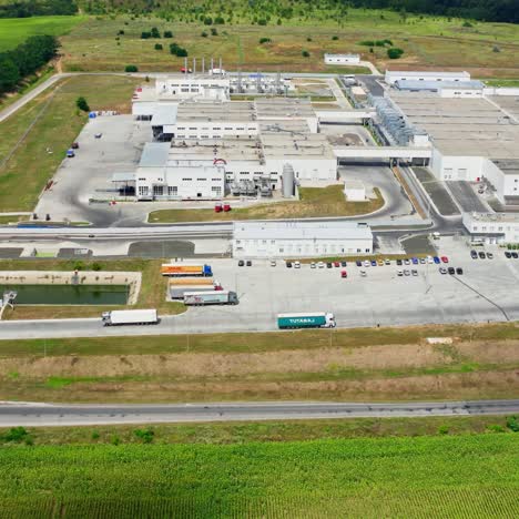 large industry on green environment. modern factory surrounded by nature. industrial territory in the countryside. aerial view
