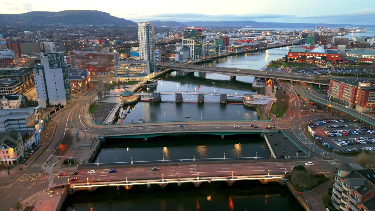 Clockwise 4K 60FPS aerial GV of the River Lagan area in Belfast City Centre, Northern Ireland at night. Produced with Rec709 color.