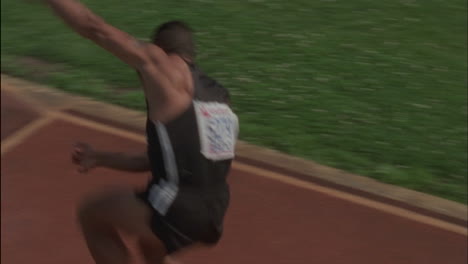 a man throws a javelin