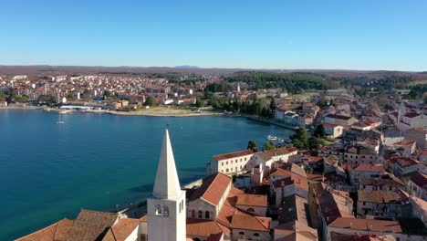 euphrasian basilica tower with porec town and seascape at daylight in croatia