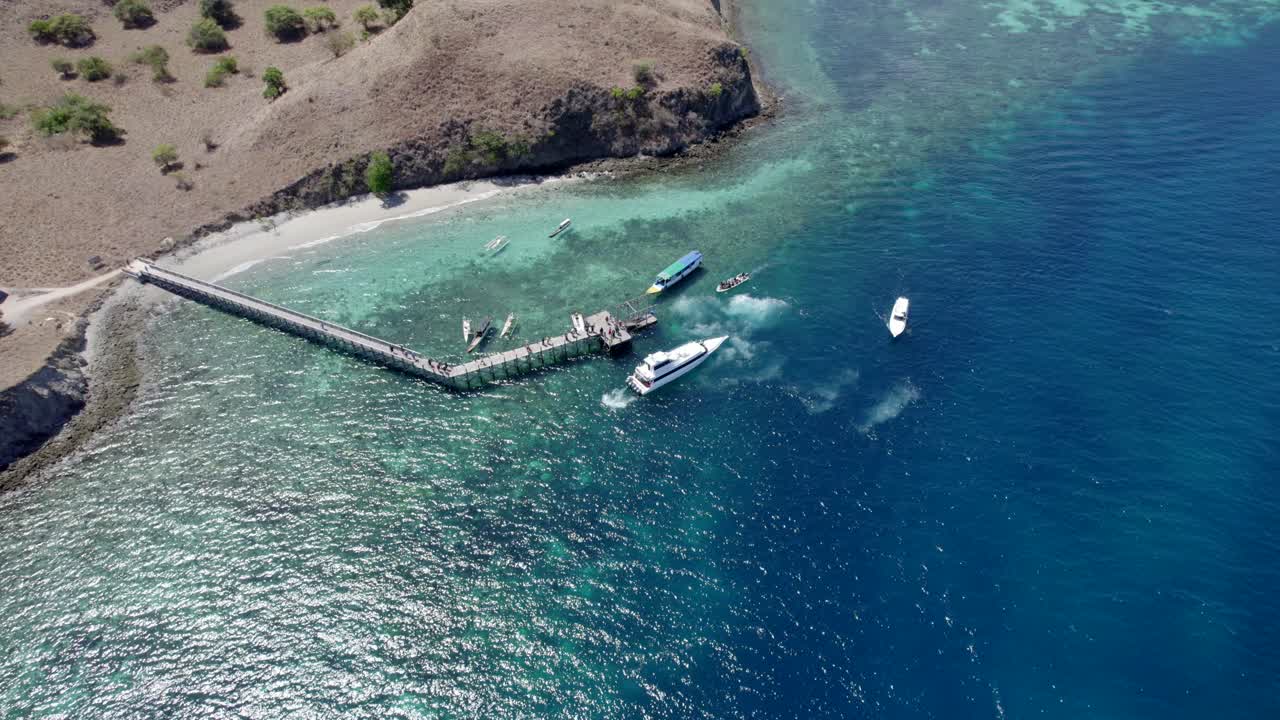 Komodo aerial of the beach and reef on a hot sunny day