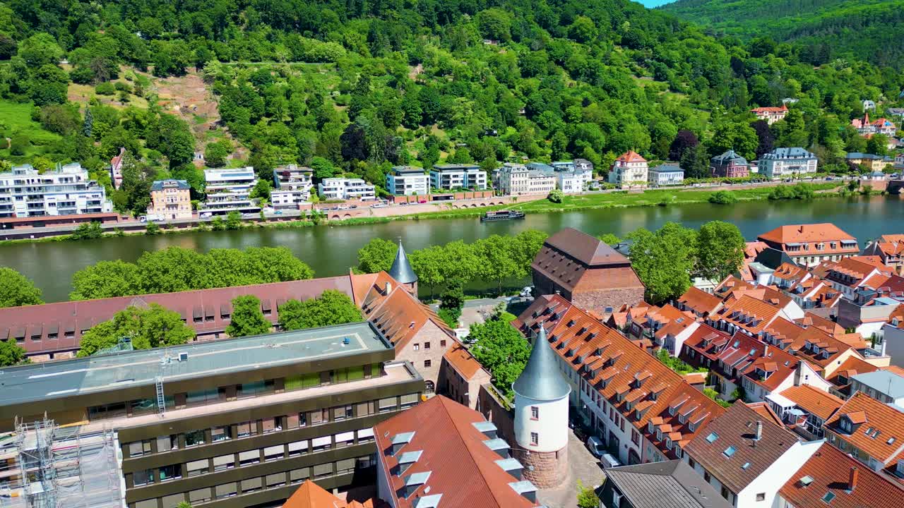 4K Aerial Drone Video of Historic Homes, Shops, and Churches along the Neckar River in Downtown Heidelberg, Germany