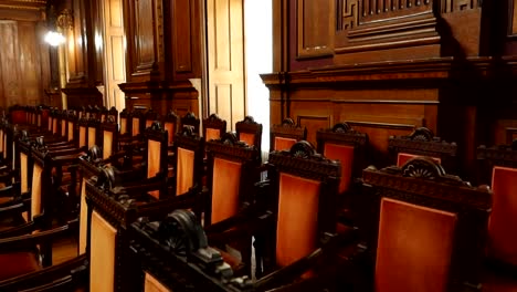 row of chairs in hall of general assemblies in palacio da bolsa, porto