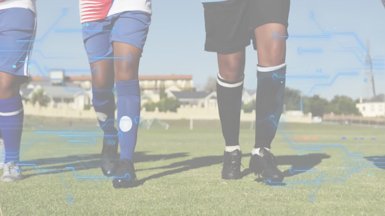 Five female soccer players starting warmup by jogging toward camera, zooming down to shin guards