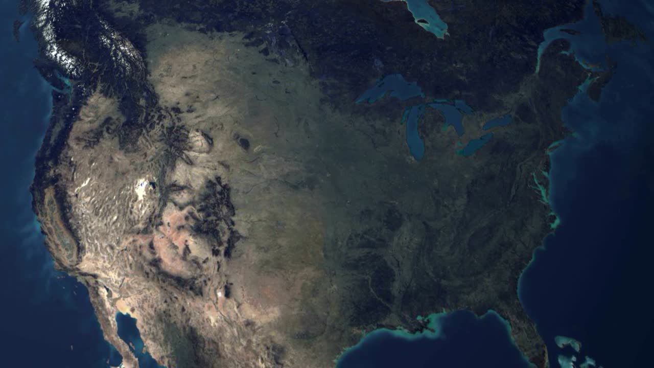 3d earth stylized spinning planet with lens flare sun zoom in to USA united states