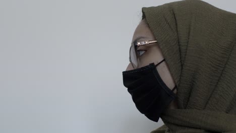 hijab woman with glasses wearing black cotton face mask