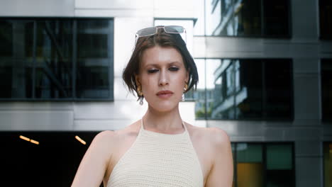 lower view of elegant woman with sunglases on her head