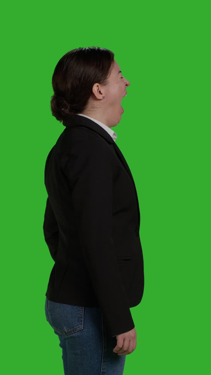 Vertical video: Profile close up of tired employee yawning and feeling fatigued