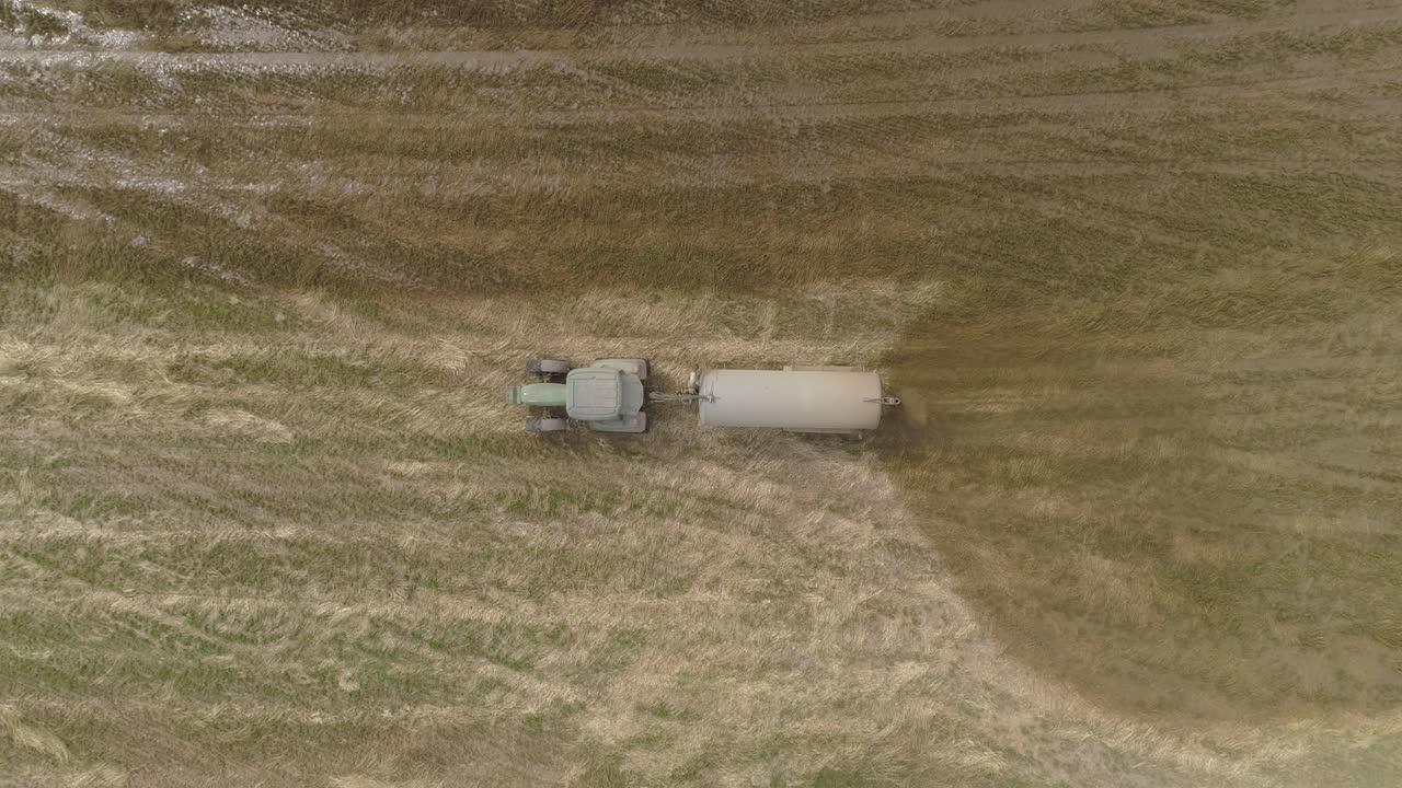 Tractor with a trailer spreading fertilizer Aerial View