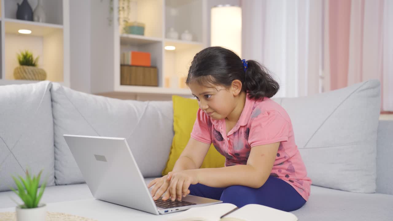 The girl child who can't use the application on the laptop.