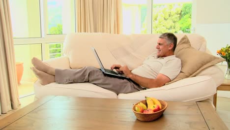 Man-delighted-with-something-on-laptop