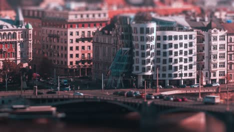 Busy-traffic-on-the-crossroad-in-front-of-the-Dancing-House-on-the-Jiraskove-square,-Prague