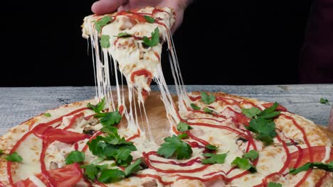 delicious pizza with a handful of fresh parsley