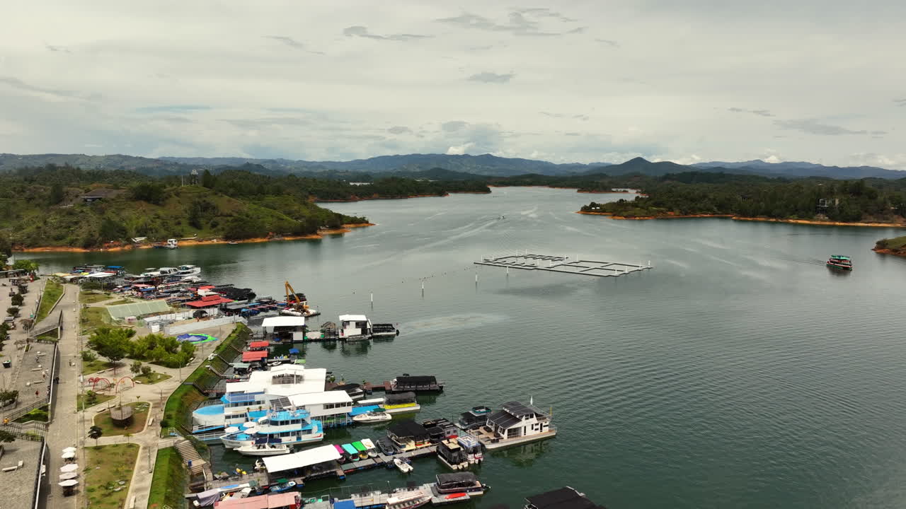 Aerial view rising over a marina at the Pe&ntilde;ol-Guatap&eacute; Reservoir in Colombia
