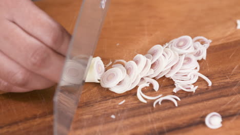 fine cutting lemongrass with a knife, finely chopped lemongrass, cutting into thin slices, close up