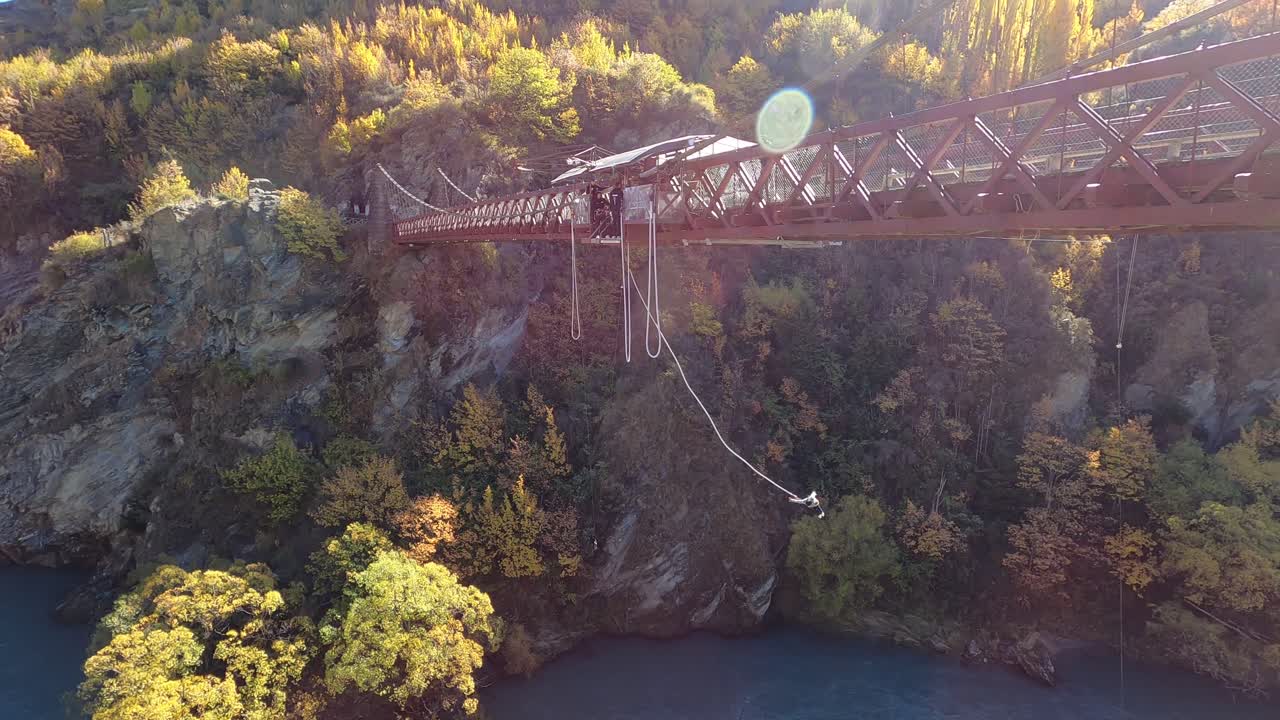 Capturing a tourist Bungee jumping at Kawarau Gorge Suspension Bridge aka AJ Hackett Kawarau Bungy Centre in New Zealand.