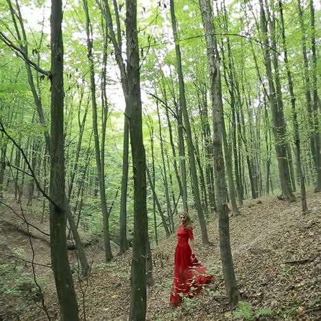 young woman walks in forest