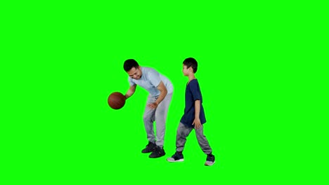 man playing basketball with his son in studio