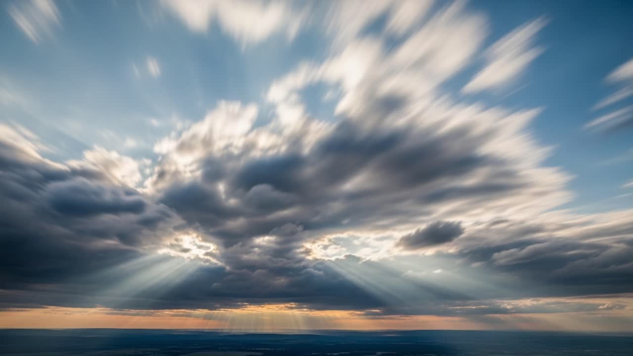 Majestic Sky Transition: A Captivating Display of Dynamic Clouds and Radiant Sunrays Illustrating the Beauty of Nature's Dramatic Transformation