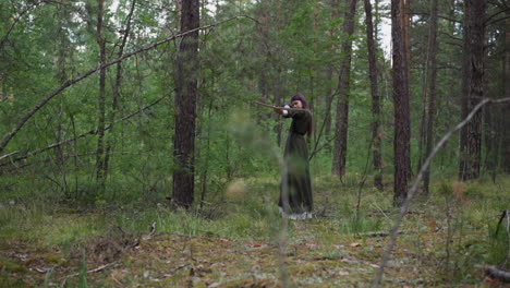 young girl takes aim and shoots