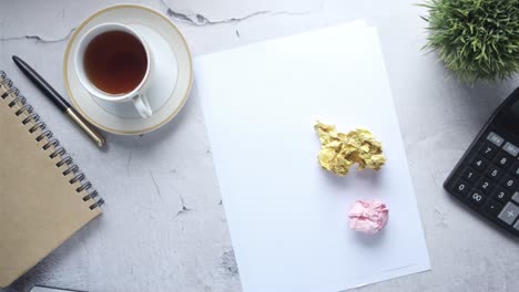 a desk setup with crumpled paper