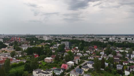 riga's darzciems neighborhood showcasing houses, trees, and urban skyline, aerial view