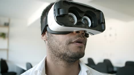 smiling african american man experiencing new vr glasses