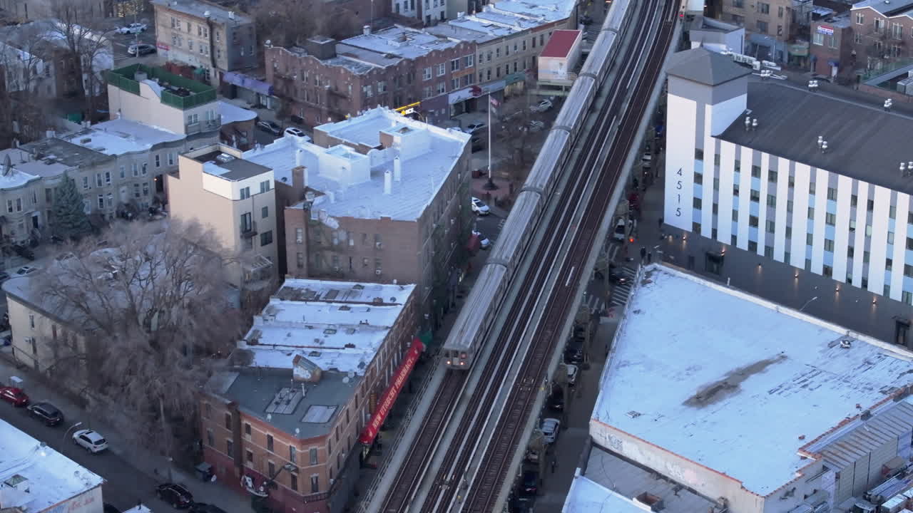 Aerial view of the subway passing through Brooklyn. Shot at dusk.