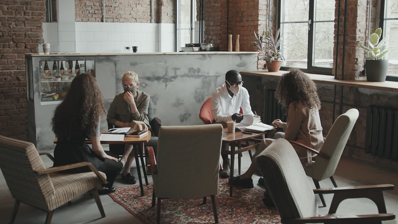 Diverse Business People in Face Masks Coworking in Modern Loft Office