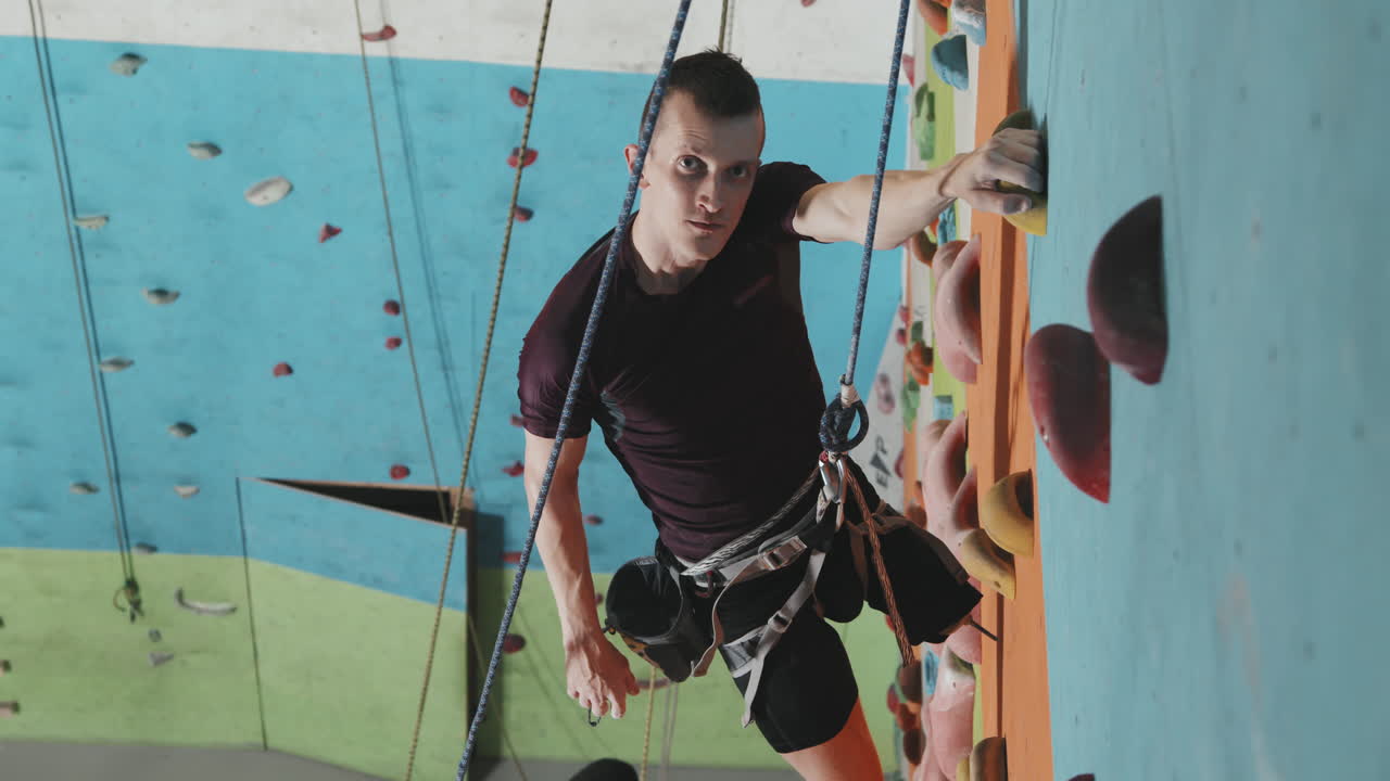 Portrait Of Sportsman With Amputated Leg At Climbing Wall