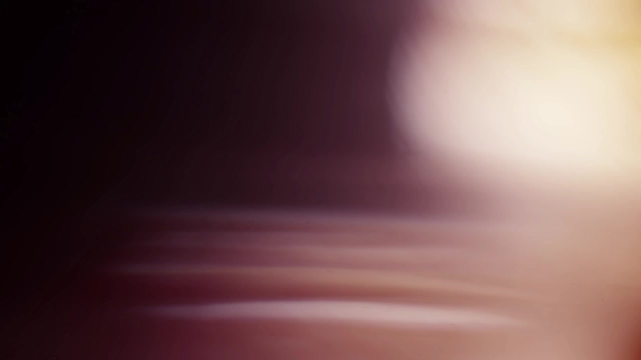 Cinematic Warm Light Leak Transition on Dark Background