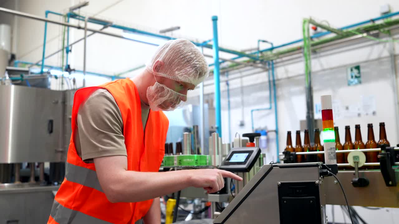 Factory Worker Operating Production Line