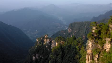 drone flying above giant rocks of zhangjiajie forest national park, hunan