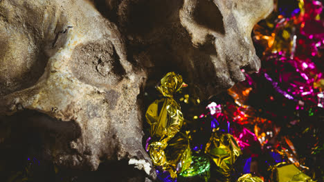 skulls and sweets lying in brown background