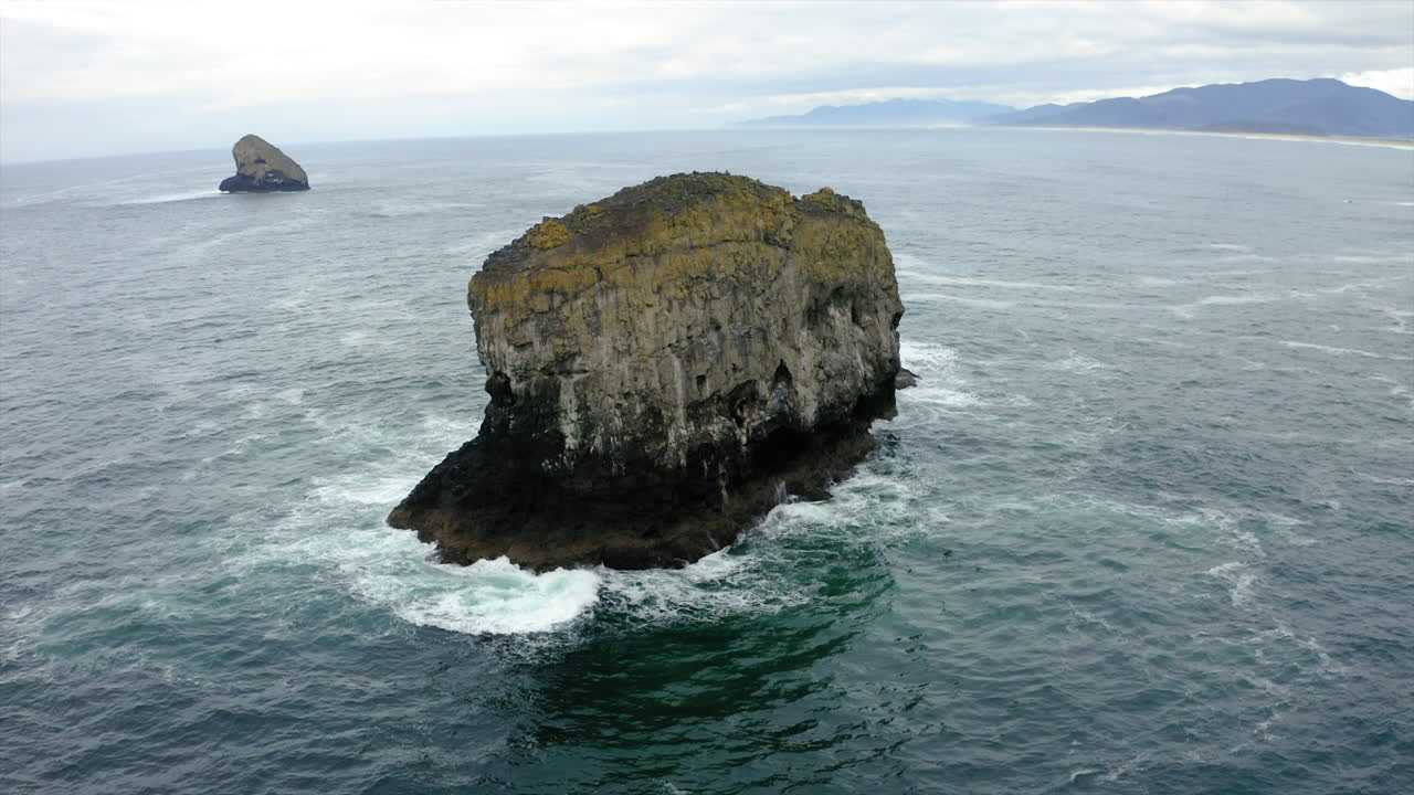 Large Sea Stack in the Ocean with Crashing Waves
