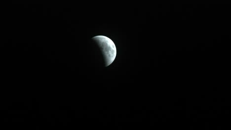 partial time-lapse of lunar eclipse in beginning stages