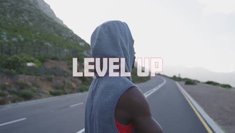 animation of the words level up in white over man exercising on mountain road taking a rest