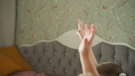 schoolchildren raises hands knowing answer to question