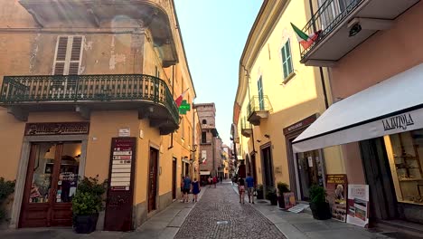 people walking down a charming, narrow street